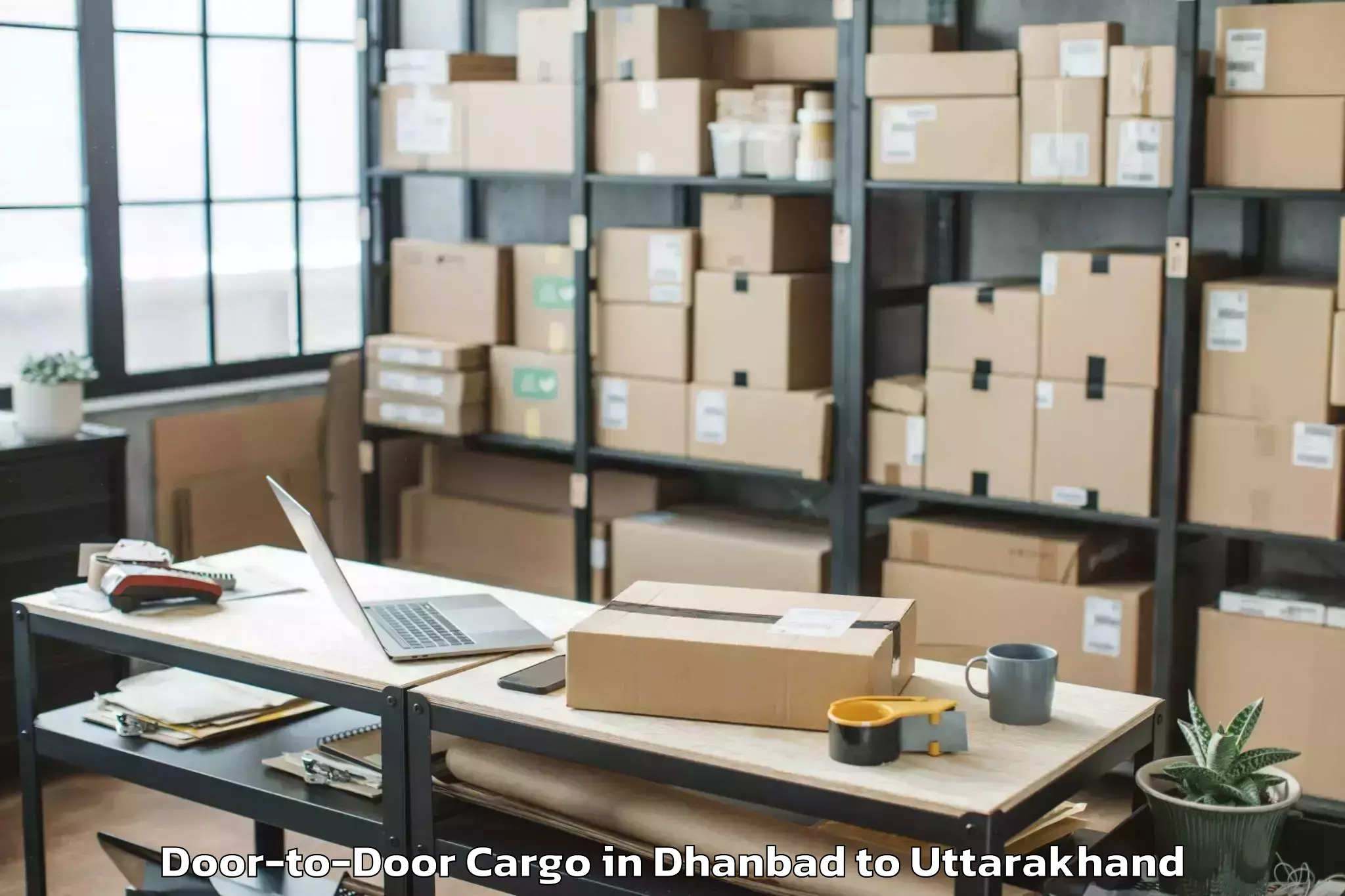 Dhanbad to Ghansali Door To Door Cargo Booking